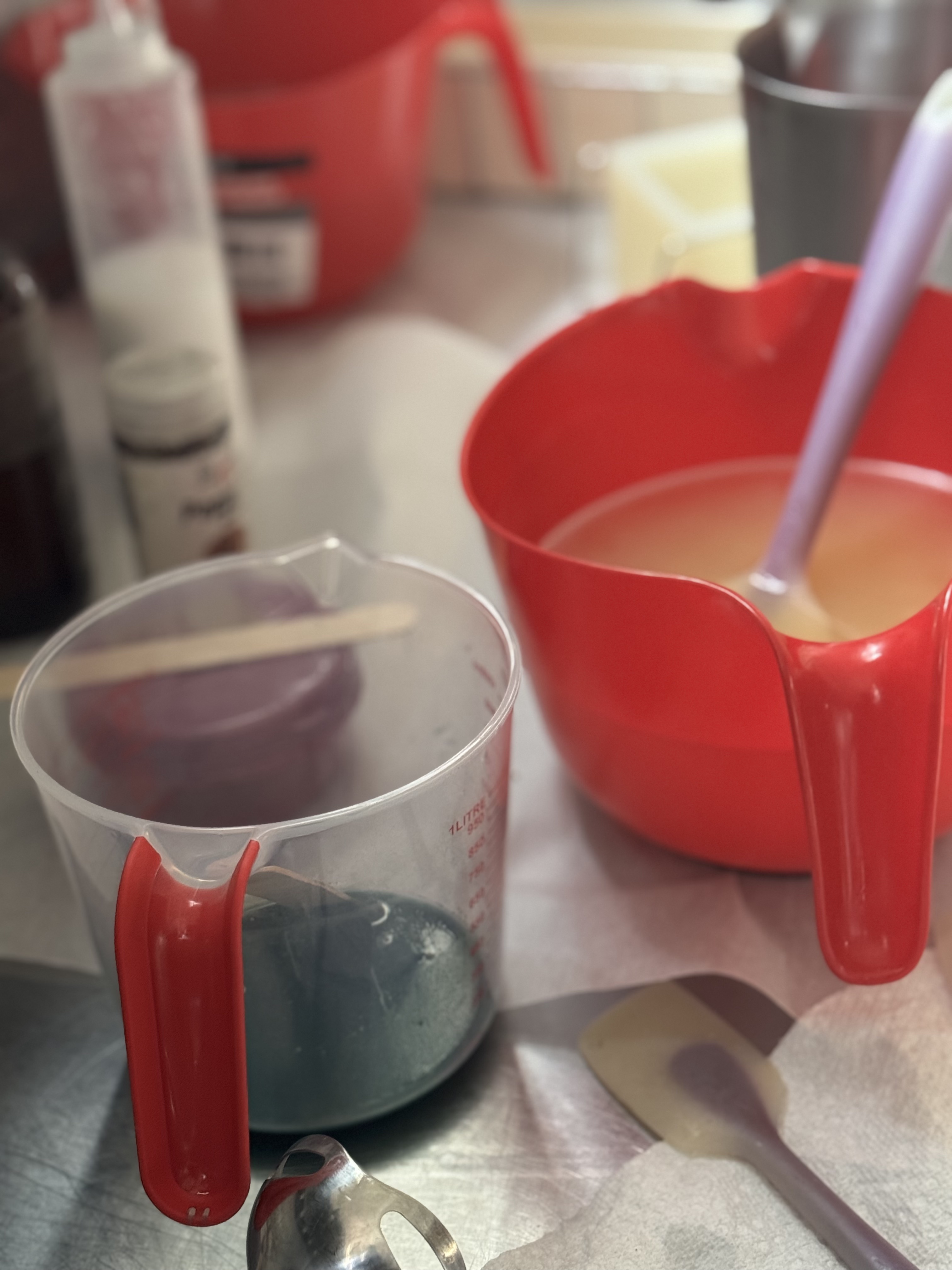 Behind the scenes in the JustAFewThings Raleigh studio — cold process soap loaves being poured, swirled, and finished by hand.