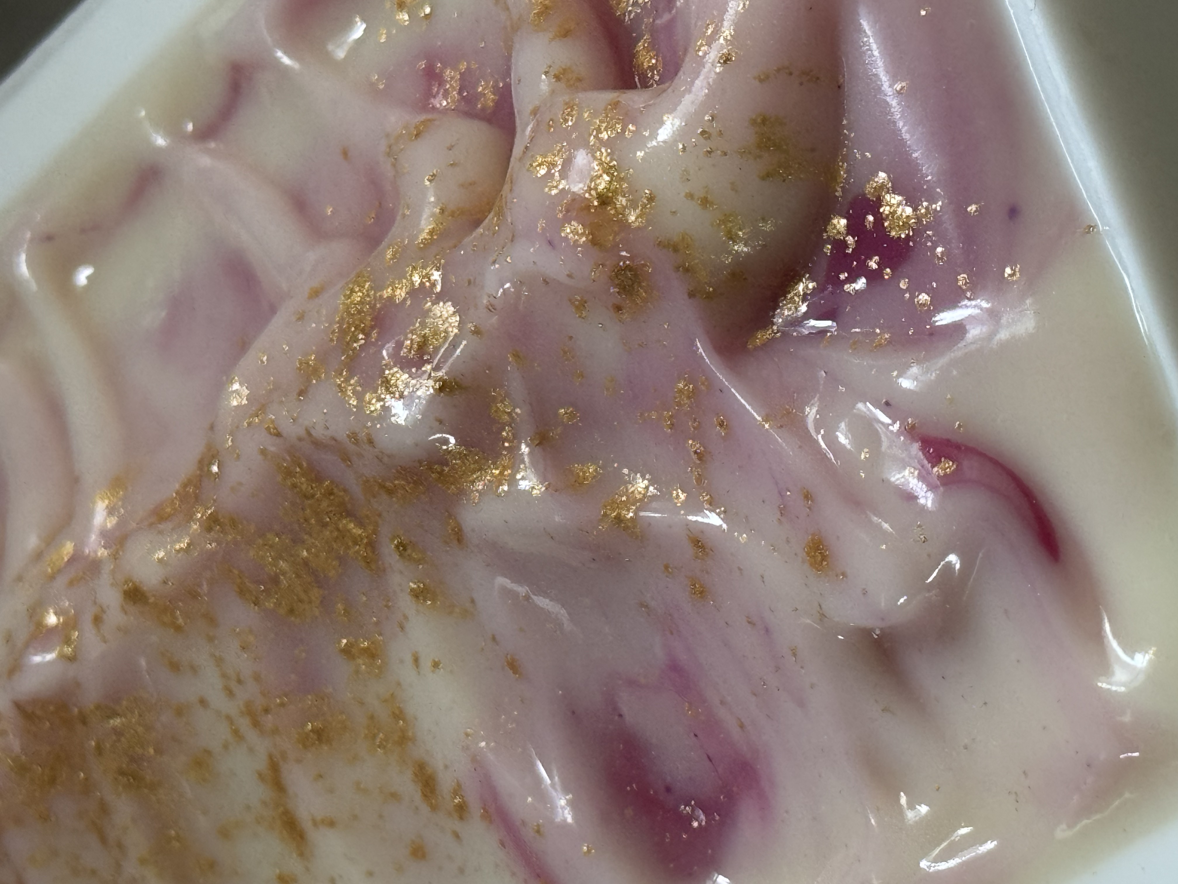 A collection of handcrafted cold process soap bars from the JustAFewThings studio in Raleigh, NC showing various swirl patterns, textures, and colorways.